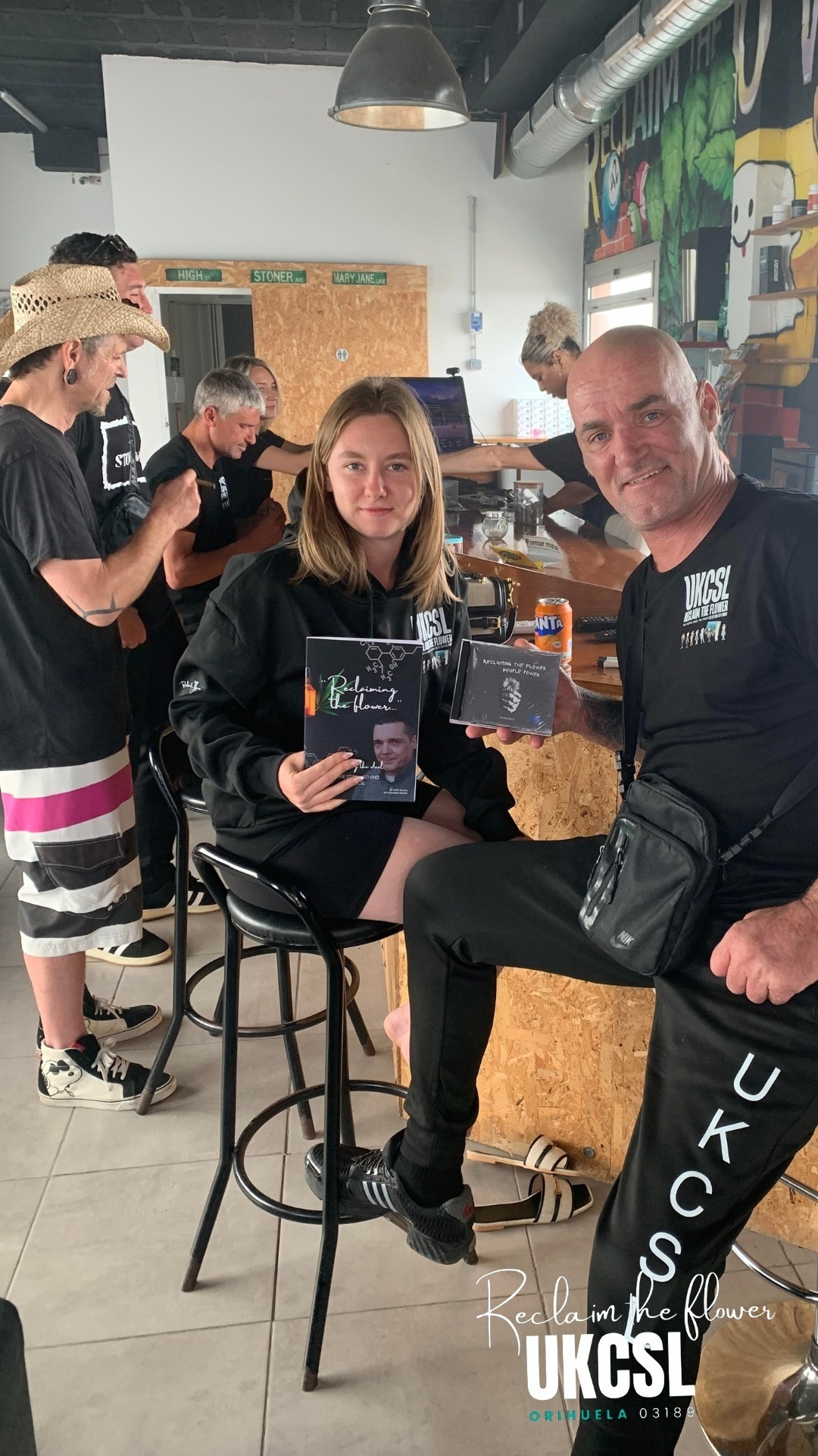 Community members with the Reclaim the Flower book and CD